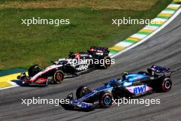 Kevin Magnussen (DEN) Haas VF-23 and Pierre Gasly (FRA) Alpine F1 Team A523 at the start of Sprint. 04.11.2023. Formula 1 World Championship, Rd 21, Brazilian Grand Prix, Sao Paulo, Brazil, Sprint Day.
