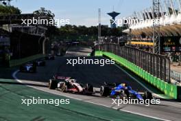 (L to R): Kevin Magnussen (DEN) Haas VF-23 and Alexander Albon (THA) Williams Racing FW45 battle for position. 04.11.2023. Formula 1 World Championship, Rd 21, Brazilian Grand Prix, Sao Paulo, Brazil, Sprint Day.
