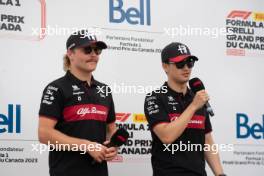 (L to R): Valtteri Bottas (FIN) Alfa Romeo F1 Team and Zhou Guanyu (CHN) Alfa Romeo F1 Team on the FanZone Stage. 16.06.2023. Formula 1 World Championship, Rd 9, Canadian Grand Prix, Montreal, Canada, Practice Day.