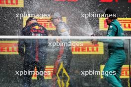 Fernando Alonso (ESP) Aston Martin F1 Team celebrates his second position on the podium with Adrian Newey (GBR) Red Bull Racing Chief Technical Officer and race winner Max Verstappen (NLD) Red Bull Racing. 18.06.2023. Formula 1 World Championship, Rd 9, Canadian Grand Prix, Montreal, Canada, Race Day.