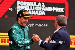 Fernando Alonso (ESP) Aston Martin F1 Team celebrates his second position with Stefano Domenicali (ITA) Formula One President and CEO on the podium. 18.06.2023. Formula 1 World Championship, Rd 9, Canadian Grand Prix, Montreal, Canada, Race Day.