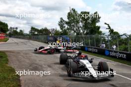 Nyck de Vries (NLD) AlphaTauri AT04 and Kevin Magnussen (DEN) Haas VF-23 run on at the exit road and reverse back on to the circuit. 18.06.2023. Formula 1 World Championship, Rd 9, Canadian Grand Prix, Montreal, Canada, Race Day.