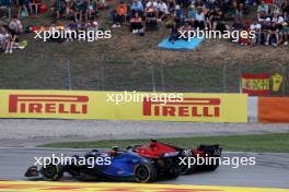 Charles Leclerc (MON) Ferrari SF-23 and Logan Sargeant (USA) Williams Racing FW45 battle for position. 04.06.2023. Formula 1 World Championship, Rd 8, Spanish Grand Prix, Barcelona, Spain, Race Day.