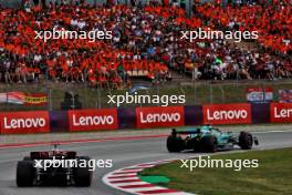 Fernando Alonso (ESP) Aston Martin F1 Team AMR23 leads George Russell (GBR) Mercedes AMG F1 W14. 04.06.2023. Formula 1 World Championship, Rd 8, Spanish Grand Prix, Barcelona, Spain, Race Day.