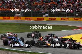 Pierre Gasly (FRA) Alpine F1 Team A523 Sergio Perez (MEX) Red Bull Racing RB19; and Zhou Guanyu (CHN) Alfa Romeo F1 Team C43 at the start of the race. 04.06.2023. Formula 1 World Championship, Rd 8, Spanish Grand Prix, Barcelona, Spain, Race Day.