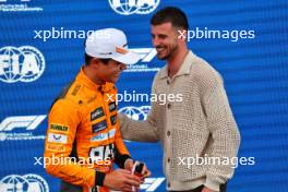 (L to R): Lando Norris (GBR) McLaren in qualifying parc ferme with Mason Mount (GBR) Football Player. 03.06.2023. Formula 1 World Championship, Rd 8, Spanish Grand Prix, Barcelona, Spain, Qualifying Day.