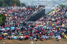 Circuit atmosphere - fans with umbrellas up as rain falls in the third practice session. 03.06.2023. Formula 1 World Championship, Rd 8, Spanish Grand Prix, Barcelona, Spain, Qualifying Day.
