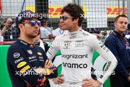 (L to R): Sergio Perez (MEX) Red Bull Racing with Lance Stroll (CDN) Aston Martin F1 Team on the grid. 09.07.2023. Formula 1 World Championship, Rd 11, British Grand Prix, Silverstone, England, Race Day.