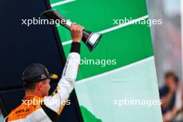 Lando Norris (GBR) McLaren celebrates his second position on the podium. 09.07.2023. Formula 1 World Championship, Rd 11, British Grand Prix, Silverstone, England, Race Day.
