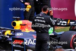 Lewis Hamilton (GBR) Mercedes AMG F1 W14 looks at the Red Bull Racing RB19 in parc ferme. 09.07.2023. Formula 1 World Championship, Rd 11, British Grand Prix, Silverstone, England, Race Day.
