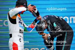 (L to R): Lando Norris (GBR) McLaren celebrates his second position on the podium with Lewis Hamilton (GBR) Mercedes AMG F1. 09.07.2023. Formula 1 World Championship, Rd 11, British Grand Prix, Silverstone, England, Race Day.