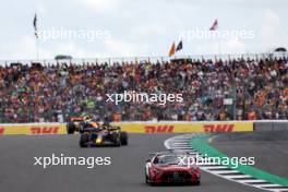 Max Verstappen (NLD) Red Bull Racing RB19 leads behind the Mercedes AMG FIA Safety Car. 09.07.2023. Formula 1 World Championship, Rd 11, British Grand Prix, Silverstone, England, Race Day.