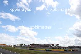 Carlos Sainz Jr (ESP) Ferrari SF-23 leads Pierre Gasly (FRA) Alpine F1 Team A523. 09.07.2023. Formula 1 World Championship, Rd 11, British Grand Prix, Silverstone, England, Race Day.