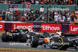 Lando Norris (GBR) McLaren MCL60 and Lewis Hamilton (GBR) Mercedes AMG F1 W14 battle for position. 09.07.2023. Formula 1 World Championship, Rd 11, British Grand Prix, Silverstone, England, Race Day.