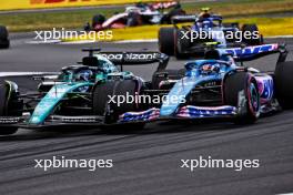 (L to R): Logan Sargeant (USA) Williams Racing FW45 and Pierre Gasly (FRA) Alpine F1 Team A523 battle for position. 09.07.2023. Formula 1 World Championship, Rd 11, British Grand Prix, Silverstone, England, Race Day.