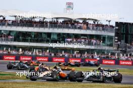 Lando Norris (GBR) McLaren MCL60 and Lewis Hamilton (GBR) Mercedes AMG F1 W14 battle for position. 09.07.2023. Formula 1 World Championship, Rd 11, British Grand Prix, Silverstone, England, Race Day.