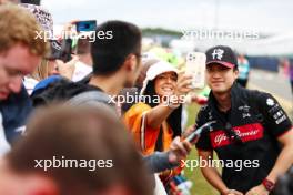 Zhou Guanyu (CHN) Alfa Romeo F1 Team with fans. 09.07.2023. Formula 1 World Championship, Rd 11, British Grand Prix, Silverstone, England, Race Day.