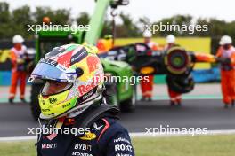 Sergio Perez (MEX) Red Bull Racing RB19 crashed in the first practice session. 21.07.2023. Formula 1 World Championship, Rd 12, Hungarian Grand Prix, Budapest, Hungary, Practice Day.