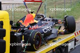 The damaged Red Bull Racing RB19 of Sergio Perez (MEX) is recovered back to the pits on the back of a truck.  21.07.2023. Formula 1 World Championship, Rd 12, Hungarian Grand Prix, Budapest, Hungary, Practice Day.