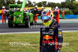 Sergio Perez (MEX) Red Bull Racing RB19 crashed in the first practice session. 21.07.2023. Formula 1 World Championship, Rd 12, Hungarian Grand Prix, Budapest, Hungary, Practice Day.