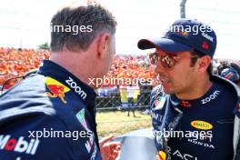 Sergio Perez (MEX) Red Bull Racing (Right) with Christian Horner (GBR) Red Bull Racing Team Principal on the grid. 23.07.2023. Formula 1 World Championship, Rd 12, Hungarian Grand Prix, Budapest, Hungary, Race Day.
