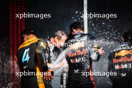 Lando Norris (GBR) McLaren celebrates his second position on the podium with race winner Max Verstappen (NLD) Red Bull Racing. 23.07.2023. Formula 1 World Championship, Rd 12, Hungarian Grand Prix, Budapest, Hungary, Race Day.