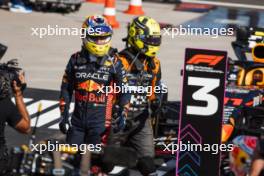 (L to R): third placed Sergio Perez (MEX) Red Bull Racing in parc ferme with second placed Lando Norris (GBR) McLaren. 23.07.2023. Formula 1 World Championship, Rd 12, Hungarian Grand Prix, Budapest, Hungary, Race Day.