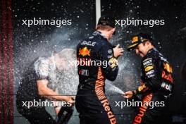 Race winner Max Verstappen (NLD) Red Bull Racing celebrates on the podium with Paul Monaghan (GBR) Red Bull Racing Chief Engineer and team mate Sergio Perez (MEX) Red Bull Racing. 23.07.2023. Formula 1 World Championship, Rd 12, Hungarian Grand Prix, Budapest, Hungary, Race Day.