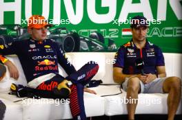 (L to R): Max Verstappen (NLD) Red Bull Racing and Sergio Perez (MEX) Red Bull Racing in the post race FIA Press Conference. 23.07.2023. Formula 1 World Championship, Rd 12, Hungarian Grand Prix, Budapest, Hungary, Race Day.