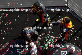 Max Verstappen (NLD) Red Bull Racing retrieves his broken trophy on the podium with Sergio Perez (MEX) Red Bull Racing and Lando Norris (GBR) McLaren. 23.07.2023. Formula 1 World Championship, Rd 12, Hungarian Grand Prix, Budapest, Hungary, Race Day.
