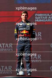 Race winner Max Verstappen (NLD) Red Bull Racing on the podium. 23.07.2023. Formula 1 World Championship, Rd 12, Hungarian Grand Prix, Budapest, Hungary, Race Day.