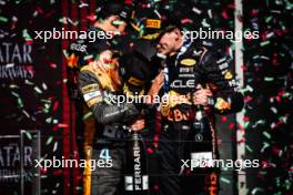 Lando Norris (GBR) McLaren celebrates his second position on the podium with race winner Max Verstappen (NLD) Red Bull Racing. 23.07.2023. Formula 1 World Championship, Rd 12, Hungarian Grand Prix, Budapest, Hungary, Race Day.