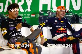 (L to R): Lando Norris (GBR) McLaren and Max Verstappen (NLD) Red Bull Racing in the post race FIA Press Conference. 23.07.2023. Formula 1 World Championship, Rd 12, Hungarian Grand Prix, Budapest, Hungary, Race Day.