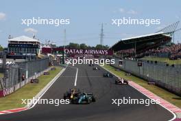 Fernando Alonso (ESP) Aston Martin F1 Team AMR23 and Sergio Perez (MEX) Red Bull Racing RB19 battle for position. 23.07.2023. Formula 1 World Championship, Rd 12, Hungarian Grand Prix, Budapest, Hungary, Race Day.