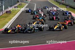 Max Verstappen (NLD) Red Bull Racing RB19 leads Lewis Hamilton (GBR) Mercedes AMG F1 W14 at the start of the race. 23.07.2023. Formula 1 World Championship, Rd 12, Hungarian Grand Prix, Budapest, Hungary, Race Day.