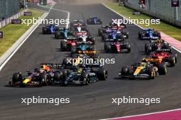 Max Verstappen (NLD) Red Bull Racing RB19 leads Lewis Hamilton (GBR) Mercedes AMG F1 W14 at the start of the race. 23.07.2023. Formula 1 World Championship, Rd 12, Hungarian Grand Prix, Budapest, Hungary, Race Day.