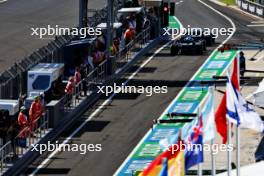 Pierre Gasly (FRA) Alpine F1 Team A523 and Esteban Ocon (FRA) Alpine F1 Team A523 at the end of the pit lane. 22.07.2023. Formula 1 World Championship, Rd 12, Hungarian Grand Prix, Budapest, Hungary, Qualifying Day.