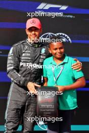 (L to R): Lewis Hamilton (GBR) Mercedes AMG F1 receives the Pirelli Pole Position Award from Zac (GBR) Sky F1 Junior Presenter. 22.07.2023. Formula 1 World Championship, Rd 12, Hungarian Grand Prix, Budapest, Hungary, Qualifying Day.