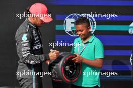 (L to R): Lewis Hamilton (GBR) Mercedes AMG F1 receives the Pirelli Pole Position Award from Zac (GBR) Sky F1 Junior Presenter. 22.07.2023. Formula 1 World Championship, Rd 12, Hungarian Grand Prix, Budapest, Hungary, Qualifying Day.