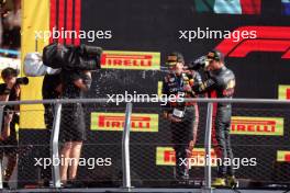 Race winner Max Verstappen (NLD) Red Bull Racing and second placed team mate Sergio Perez (MEX) Red Bull Racing celebrate on the podium. 03.09.2023. Formula 1 World Championship, Rd 15, Italian Grand Prix, Monza, Italy, Race Day.