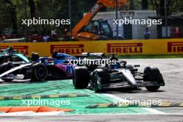 George Russell (GBR) Mercedes AMG F1 W14 leaves the pits ahead of Esteban Ocon (FRA) Alpine F1 Team A523 and runs wide. 03.09.2023. Formula 1 World Championship, Rd 15, Italian Grand Prix, Monza, Italy, Race Day.