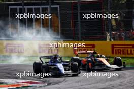 Alexander Albon (THA) Williams Racing FW45 and Lando Norris (GBR) McLaren MCL60 battle for position. 03.09.2023. Formula 1 World Championship, Rd 15, Italian Grand Prix, Monza, Italy, Race Day.