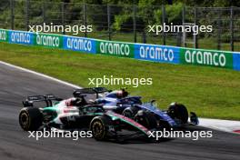 Valtteri Bottas (FIN) Alfa Romeo F1 Team C43 and Logan Sargeant (USA) Williams Racing FW45 battle for position. 03.09.2023. Formula 1 World Championship, Rd 15, Italian Grand Prix, Monza, Italy, Race Day.