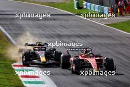 Sergio Perez (MEX) Red Bull Racing RB19 and Charles Leclerc (MON) Ferrari SF-23 battle for position. 03.09.2023. Formula 1 World Championship, Rd 15, Italian Grand Prix, Monza, Italy, Race Day.