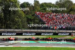 Carlos Sainz Jr (ESP) Ferrari SF-23 leads at the start of the race. 03.09.2023. Formula 1 World Championship, Rd 15, Italian Grand Prix, Monza, Italy, Race Day.