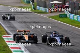 Lando Norris (GBR) McLaren MCL60 and Alexander Albon (THA) Williams Racing FW45 battle for position. 03.09.2023. Formula 1 World Championship, Rd 15, Italian Grand Prix, Monza, Italy, Race Day.
