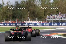 Carlos Sainz Jr (ESP) Ferrari SF-23 leads Max Verstappen (NLD) Red Bull Racing RB19. 03.09.2023. Formula 1 World Championship, Rd 15, Italian Grand Prix, Monza, Italy, Race Day.