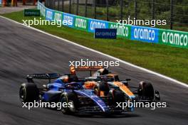 Alexander Albon (THA) Williams Racing FW45 and Oscar Piastri (AUS) McLaren MCL60 battle for position. 03.09.2023. Formula 1 World Championship, Rd 15, Italian Grand Prix, Monza, Italy, Race Day.