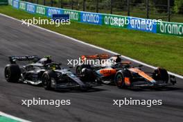 Lewis Hamilton (GBR) Mercedes AMG F1 W14 and Oscar Piastri (AUS) McLaren MCL60 battle for position. 03.09.2023. Formula 1 World Championship, Rd 15, Italian Grand Prix, Monza, Italy, Race Day.