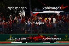 Carlos Sainz Jr (ESP) Ferrari SF-23 celebrates his pole position as he passes fans at the end of qualifying. 02.09.2023. Formula 1 World Championship, Rd 15, Italian Grand Prix, Monza, Italy, Qualifying Day.